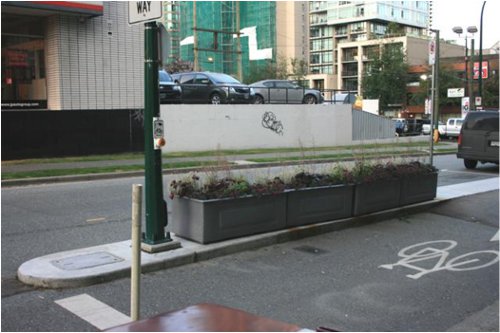 Another new bike lane, this time on Drake Street.  Note the signal button for cyclists and street parking.