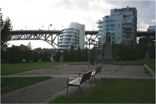 Mid rise apartment buildings next to Burrard Street Bridge on the North Shore of False Creek.