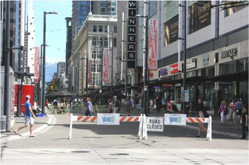 All summer long open streets on Granville. Note the absence of police officers controlling traffic and the simple barriers. Viva Vancouver is bringing open streets to many Vancouver neighbourhoods all summer long.