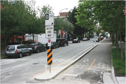 New two-direction physically separated bike lanes at the south end of Hornby Street.  This is the way to make a one-way street pedestrian friendly: wide side walks with a double buffer of trees and parking/cycle lane.